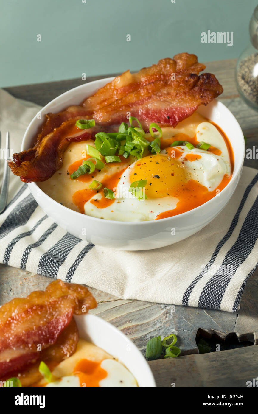 Homemade Cheesy Breakfast Grits with Eggs and Bacon Stock Photo Alamy
