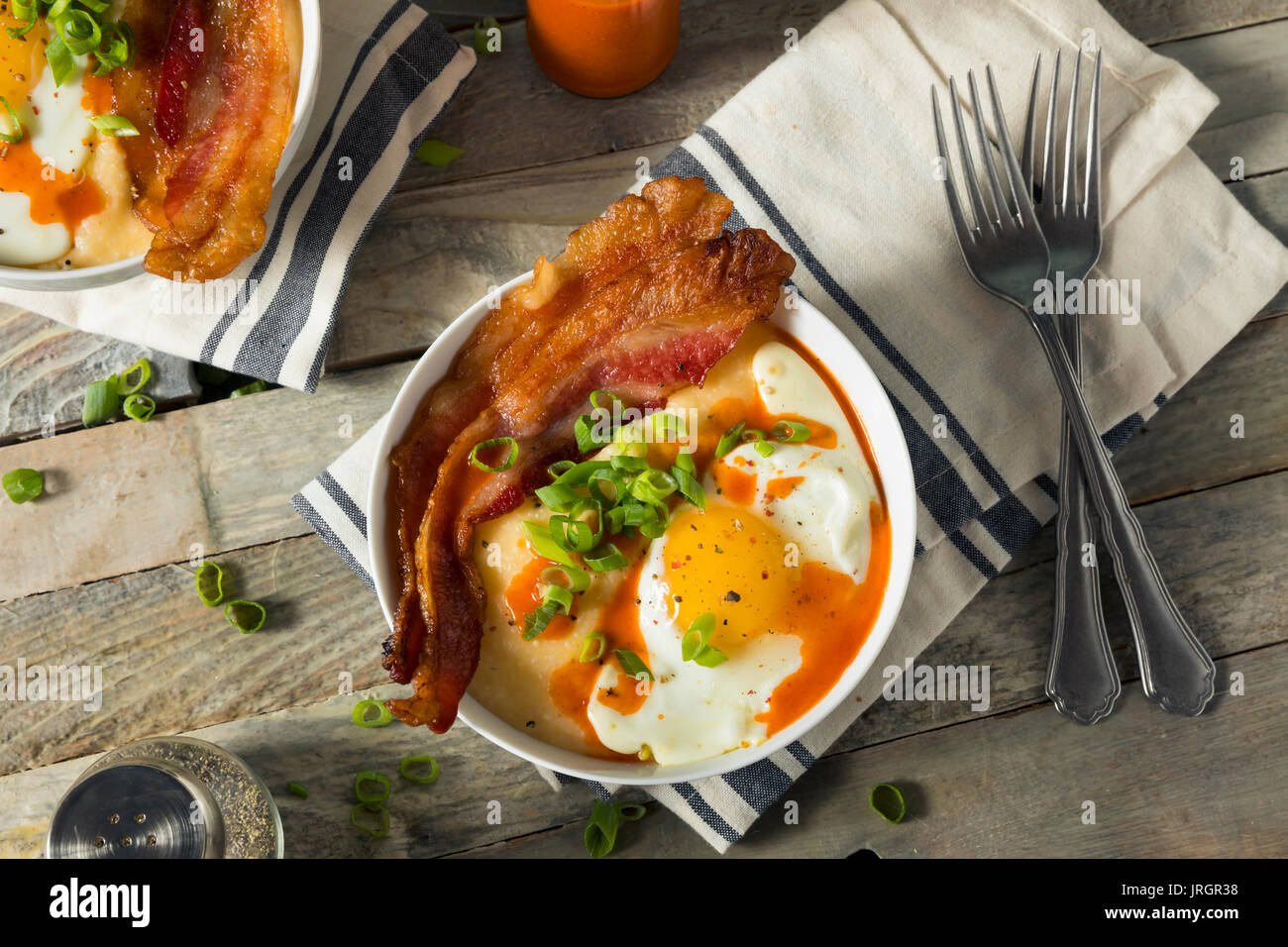 Homemade Cheesy Breakfast Grits with Eggs and Bacon Stock Photo Alamy