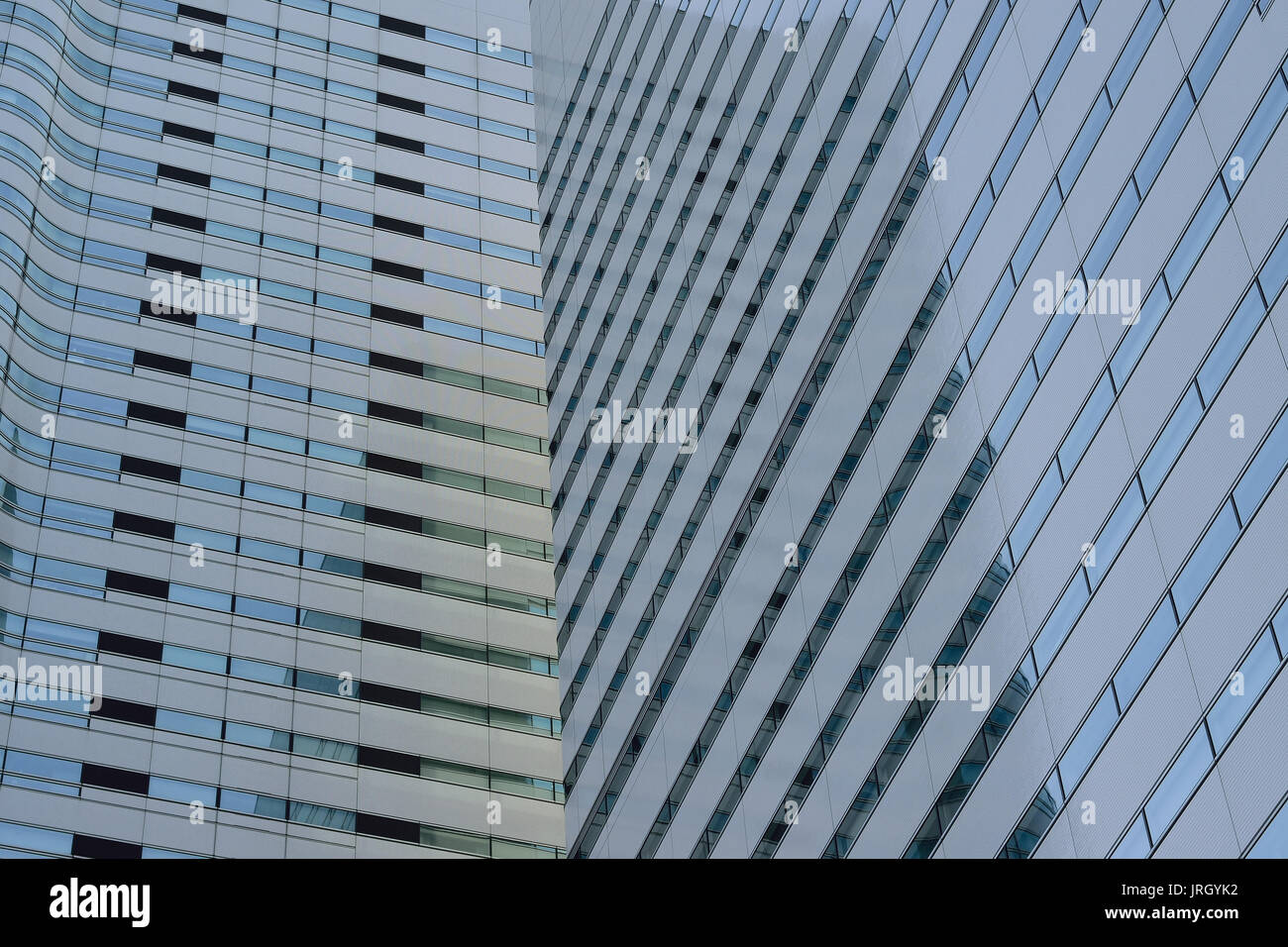 Tall office building in blue sky background Stock Photo - Alamy