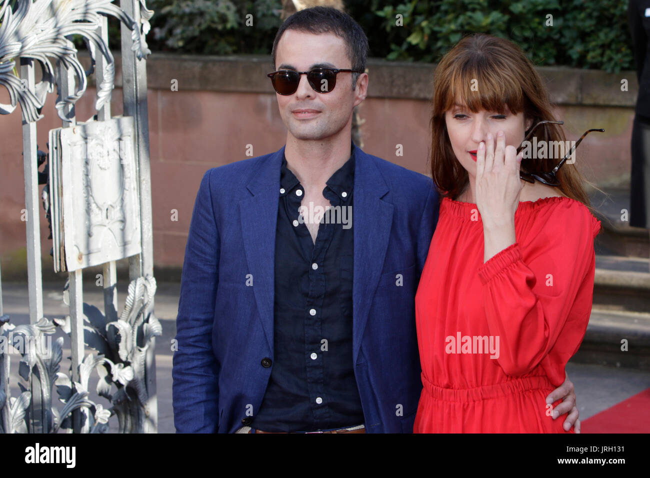 Worms, Germany. 04th Aug, 2017. German actor Nikolai Kinski and his girlfriend the German actress and singer Ina Paule Klink pose for the cameras on the red carpet. Actors, politicians and other VIPs attended the opening night of the 2017 Nibelung Festival in Worms. The play in the 16. Season of the festival is called ‘Glow - Siegfried of Arabia' from Albert Ostermaier. Credit: Michael Debets/Pacific Press/Alamy Live News Stock Photo