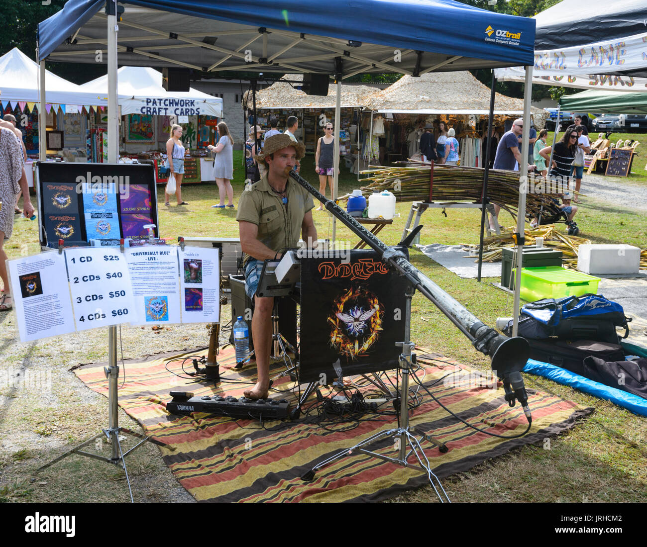 Musician playing didgeridoo at the Sunday Markets, Port Douglas, Far North Queensland, FNQ, QLD, Australia Stock Photo
