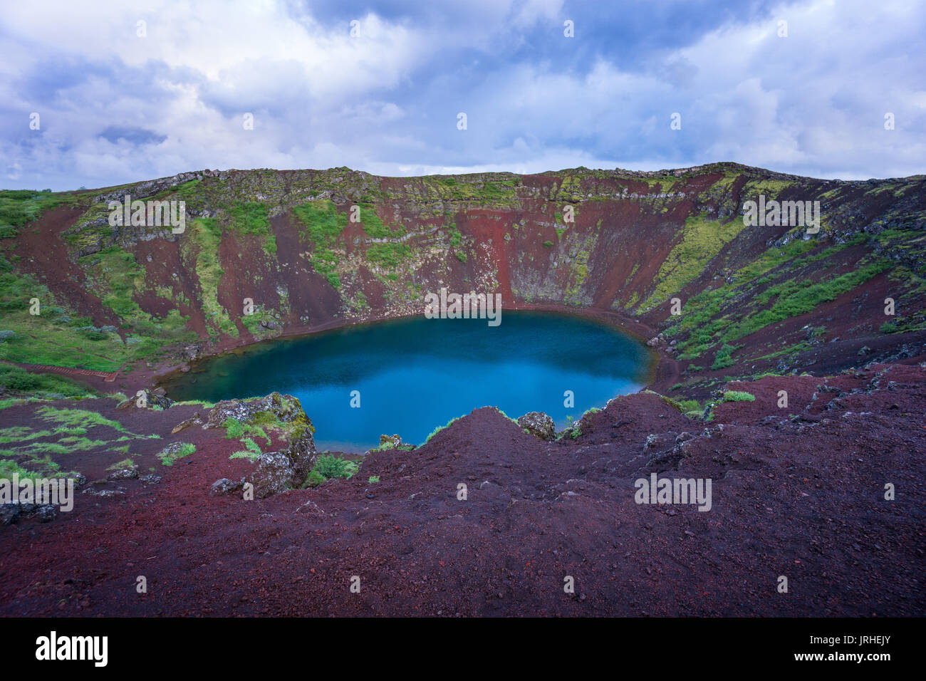 Iceland - Magical moment at Kerid Crater Lake with red stones Stock Photo