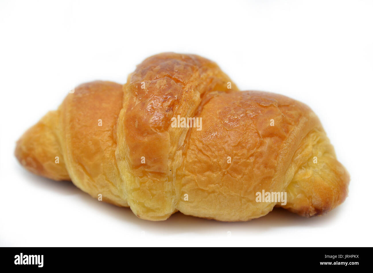 Fresh baked croissant isolated on white background Stock Photo - Alamy