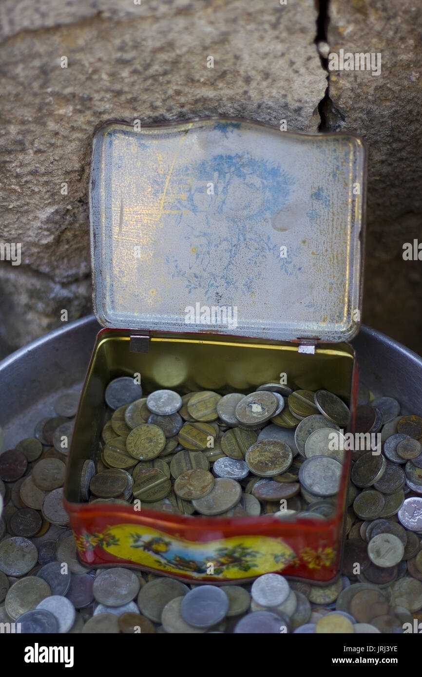 Old aged coins in the metal box Stock Photo