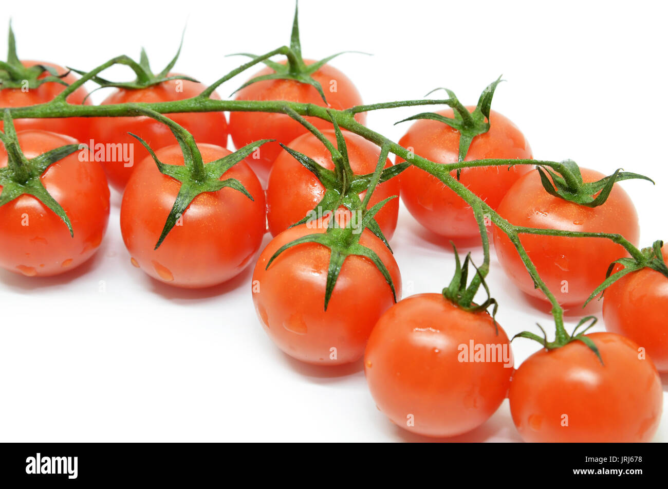 Red cherry tomato isolated on white background Stock Photo - Alamy