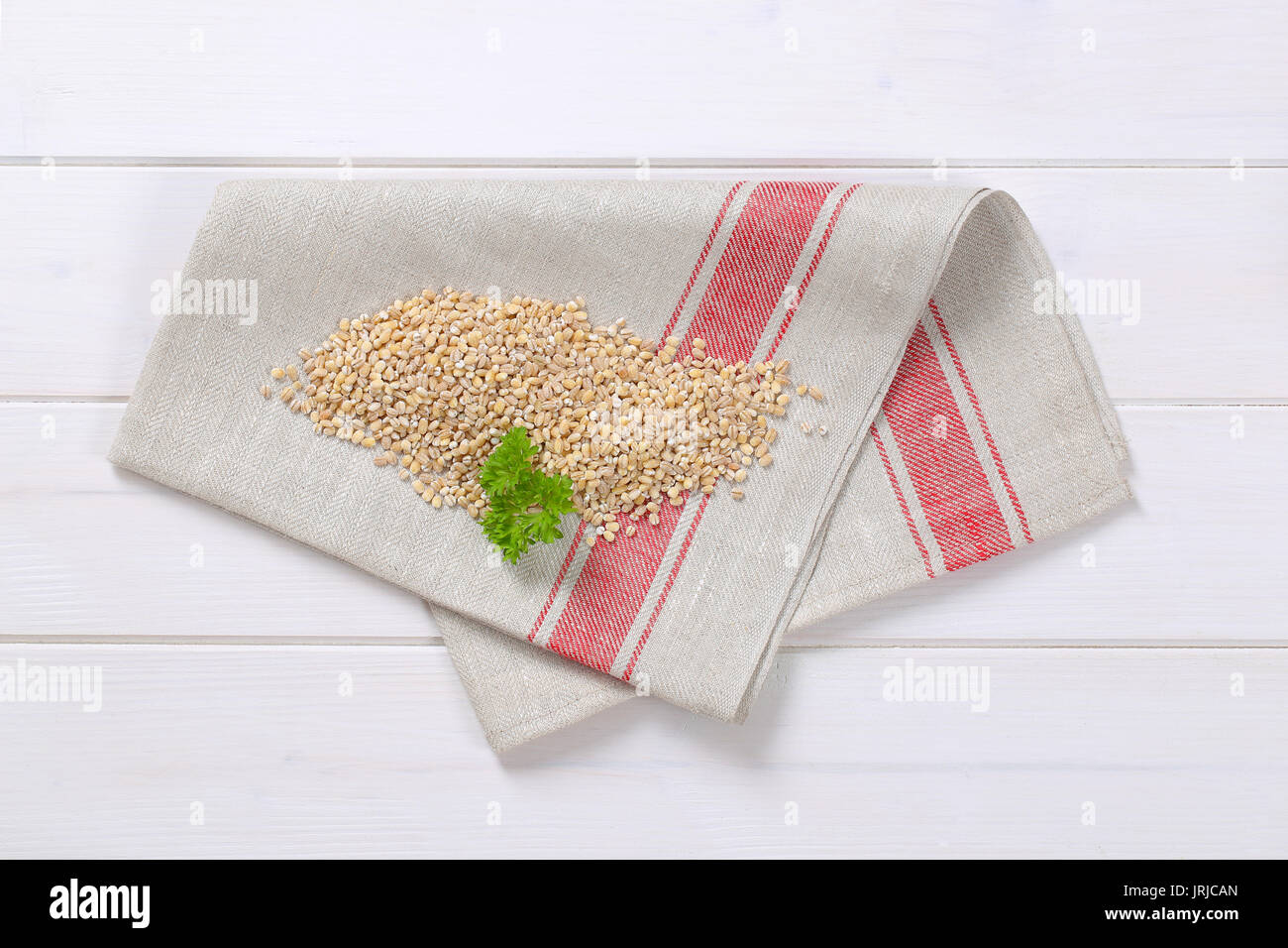 pile of pearl barley on folded place mat Stock Photo