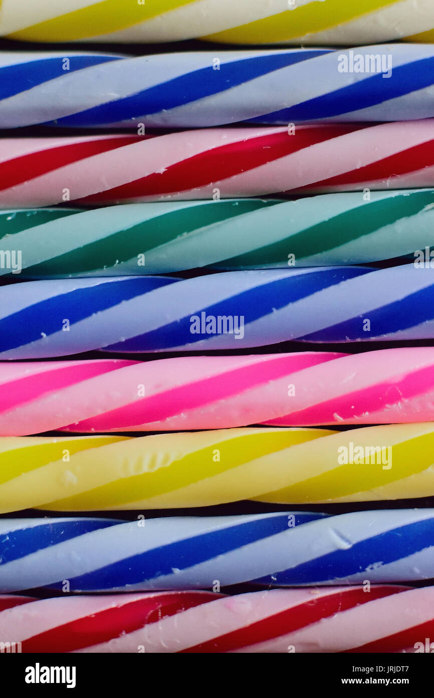 Macro background texture colorful lined up birthday cake candles Stock Photo