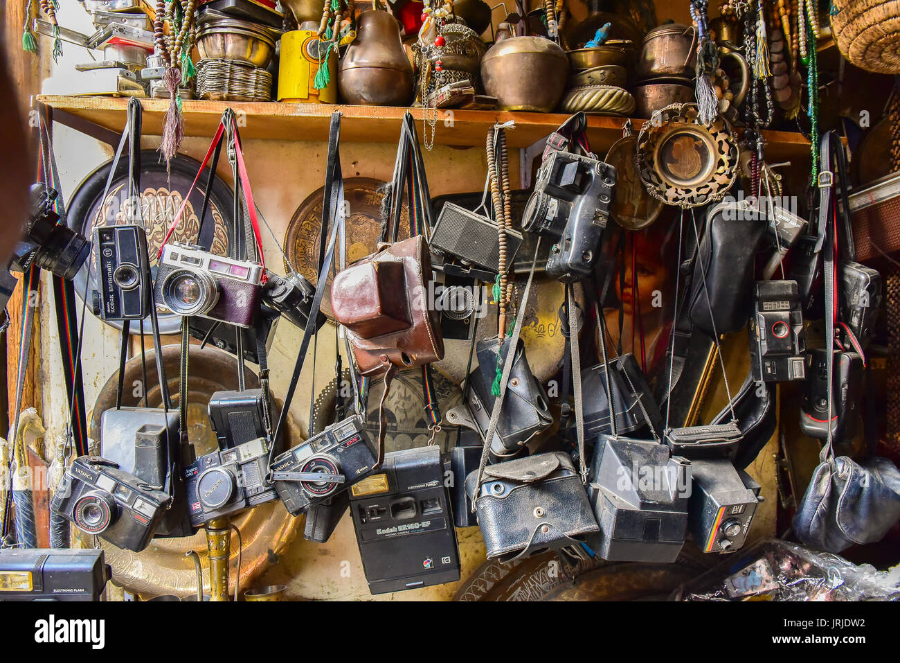 old cameras hanging from a rack in the old shopping district in Cairo ...