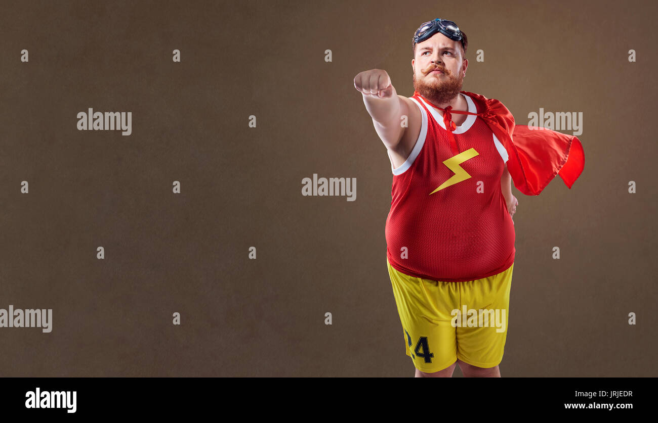 Fat funny man in a superhero costume Stock Photo Alamy