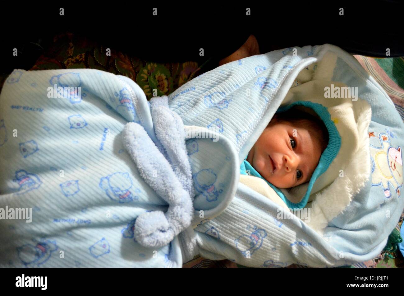 A swaddled baby Stock Photo Alamy