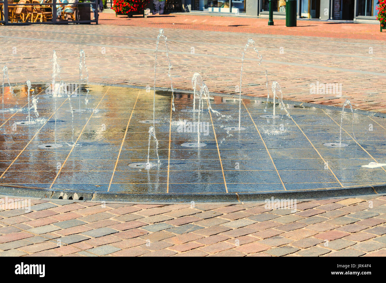 Fountain, water play in a pedestrian zone. Stock Photo