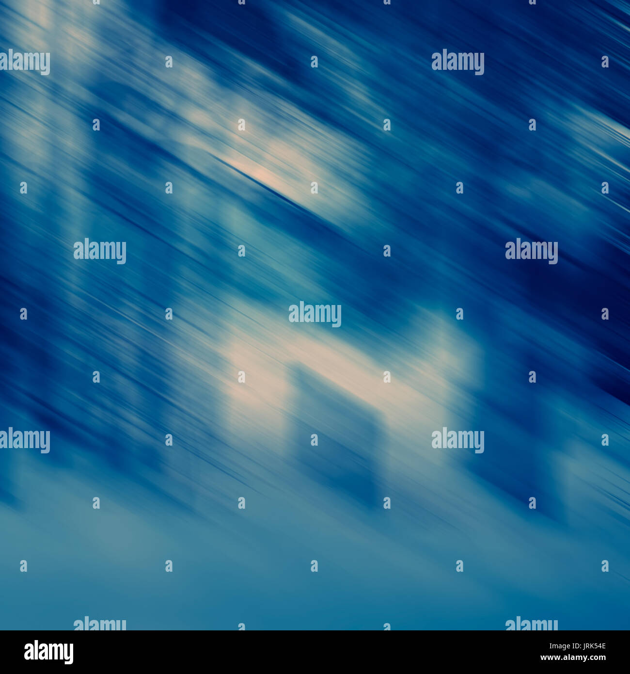 Abstract diagonal spots and lines in blue tonality, blurred background ...