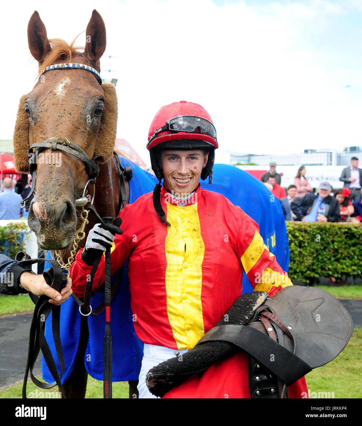 Aydoun and jockey Bryan Cooper celebrate winning the O'Leary Insurances Maiden Hurdle during Super Saturday of the Galway Summer Festival at Galway Racecourse. Stock Photo