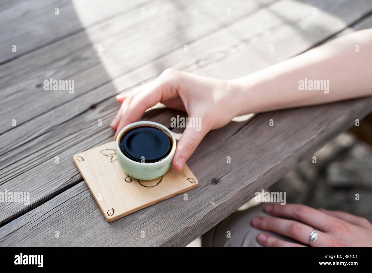 Traditional Chinese tea ceremony woman's hand holding a Chinese tea