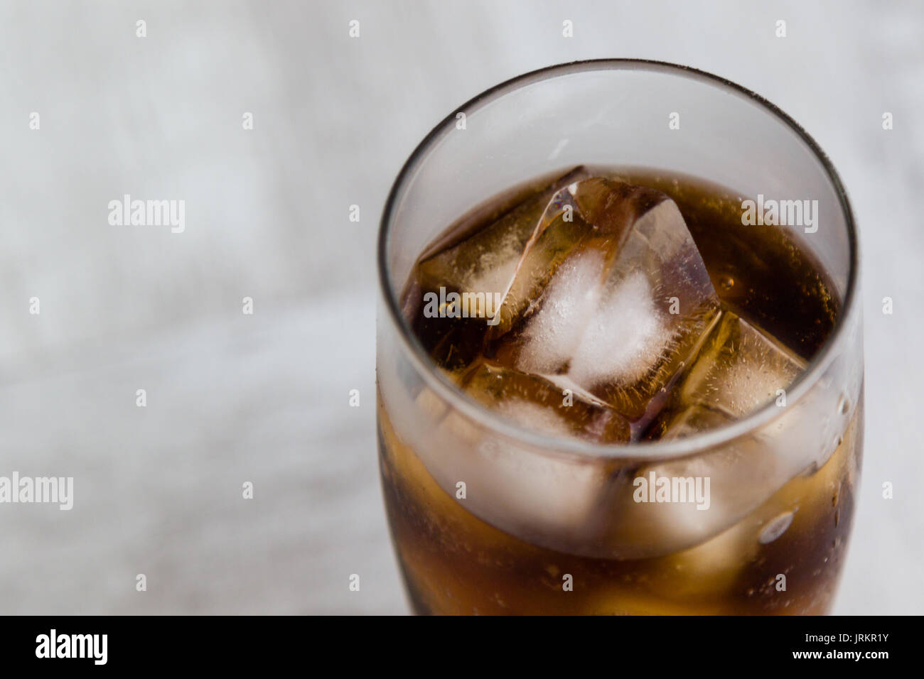 Cold Fizzy Cola Soda With Ice In Glass Cup Stock Photo - Download