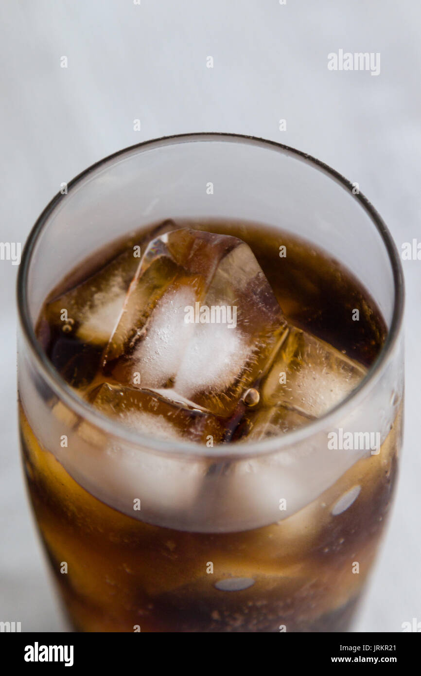 Cold Fizzy Cola Soda With Ice In Glass Cup Stock Photo - Download