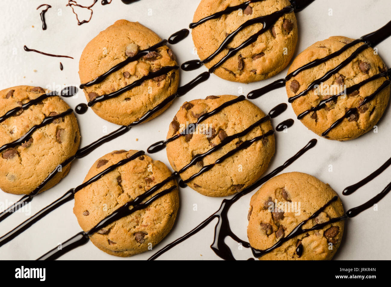 brown chocolate biscuits with syrup on white table Stock Photo