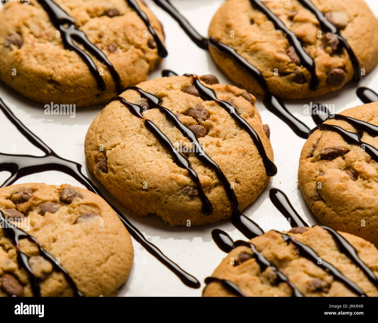 brown chocolate biscuits with syrup on white table Stock Photo