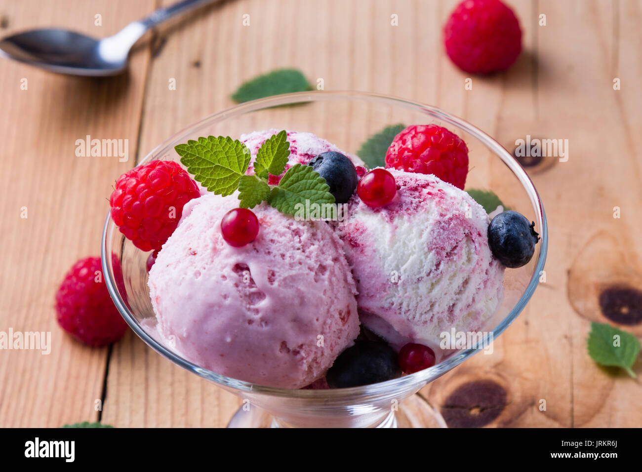 fruit flavored ice cream in glass bowl Stock Photo