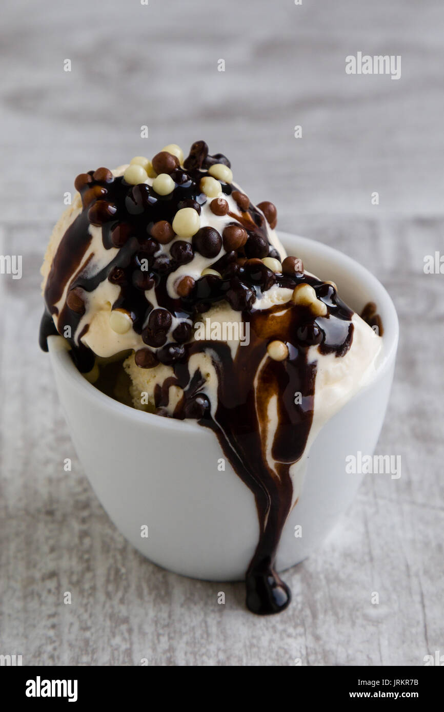 creamy vanilla ice cream with chocolate sprinkles and syrup Stock Photo Alamy