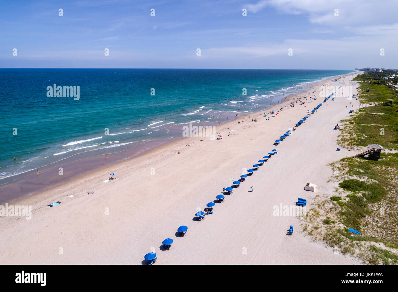 Delray Beach Florida,Atlantic Ocean,sand,blue umbrellas,aerial overhead