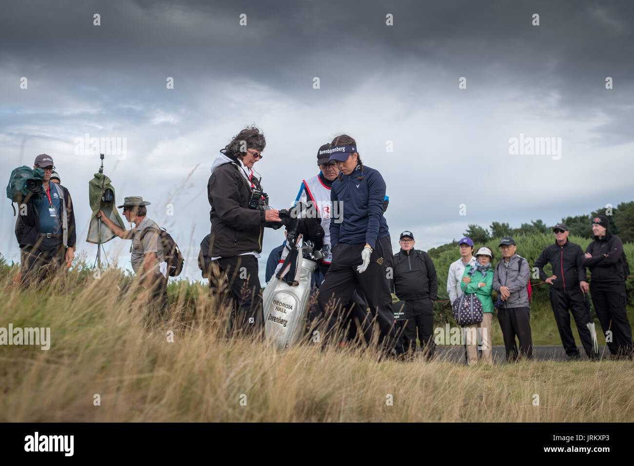 England's Georgia Hall calls in a rules official after going through the back of the 9th and coming to rest in what appeared to be a animal scraping during day three of the 2017 Ricoh Women's British Open at Kingsbarns Golf Links, St Andrews. Stock Photo