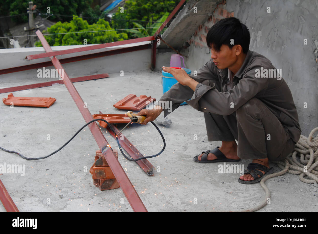 HAI DUONG, VIETNAM, JULY, 4: Workers weld steel bar on july, 2014 in Hai Duong, Vietnam. Stock Photo