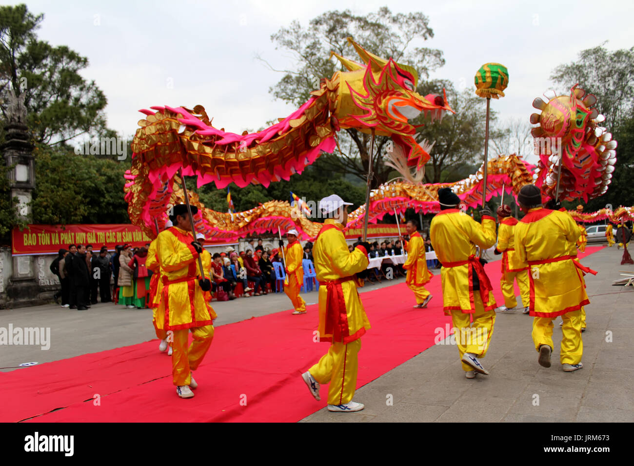 HAI DUONG, VIETNAM, February 14: a group of Asian people dance dragon in folk festivals on February 14, 2014 in Con Son pagoda, Hai Duong, Vietnam. Stock Photo