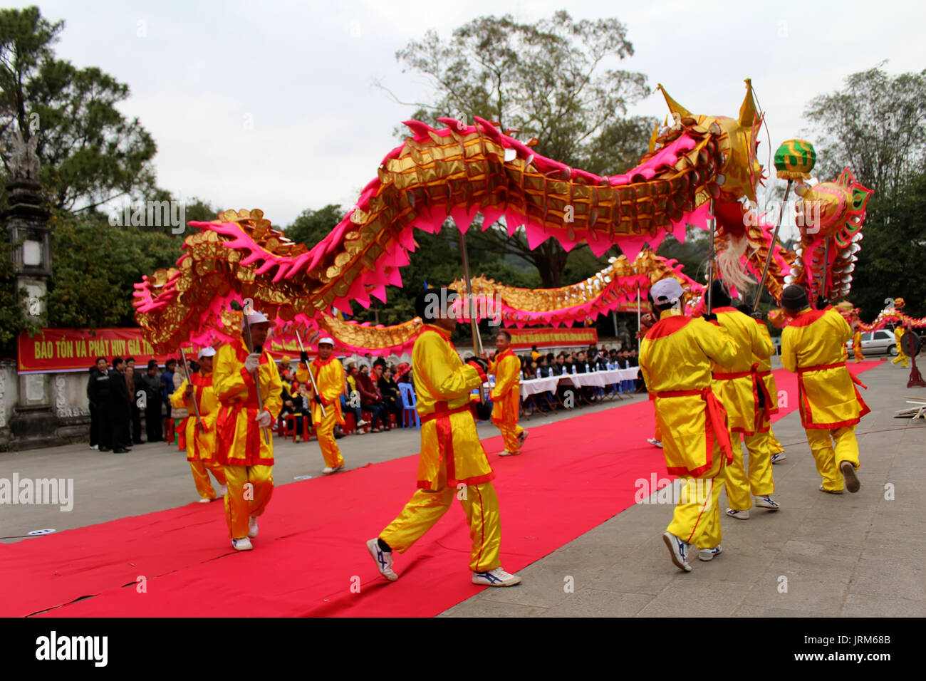 HAI DUONG, VIETNAM, February 14: a group of Asian people dance dragon in folk festivals on February 14, 2014 in Con Son pagoda, Hai Duong, Vietnam. Stock Photo