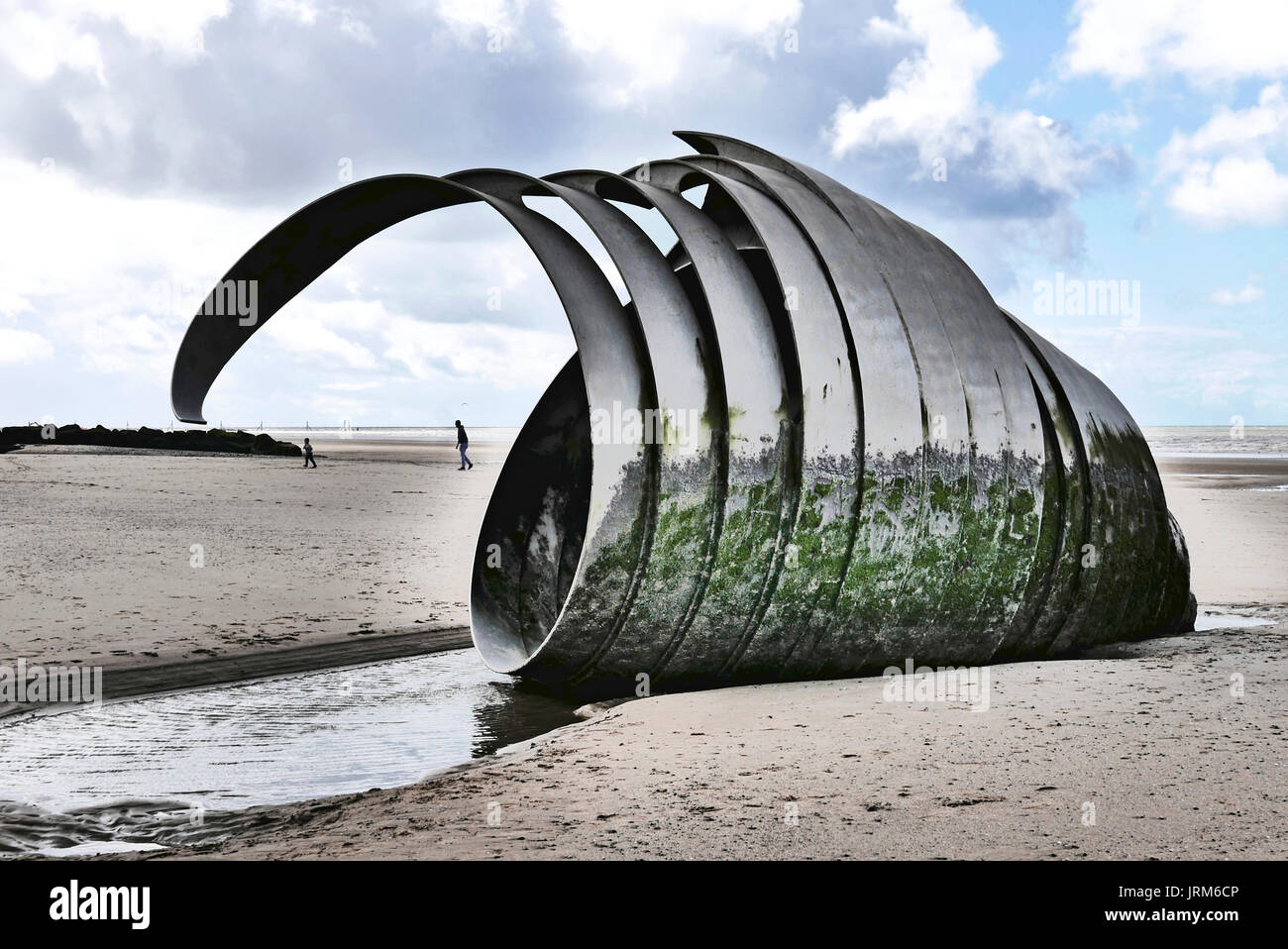 Mary's Shell sculpture on Cleveleys beach at low tide with father and