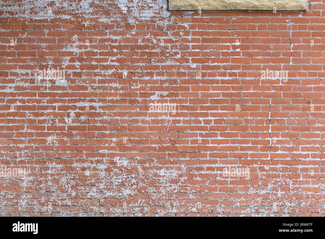 Old brick wall, white paint Stock Photo