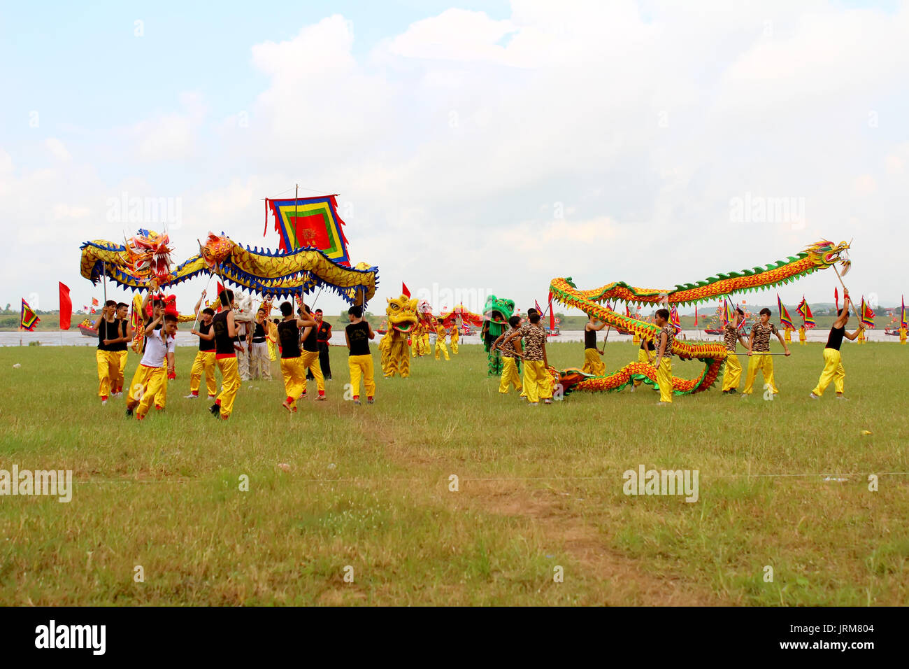 HAI DUONG, VIETNAM, SEPTEMBER, 10: a group of Asian people dance dragon in folk festivals on September, 10, 2014 in Hai Duong, Vietnam Stock Photo