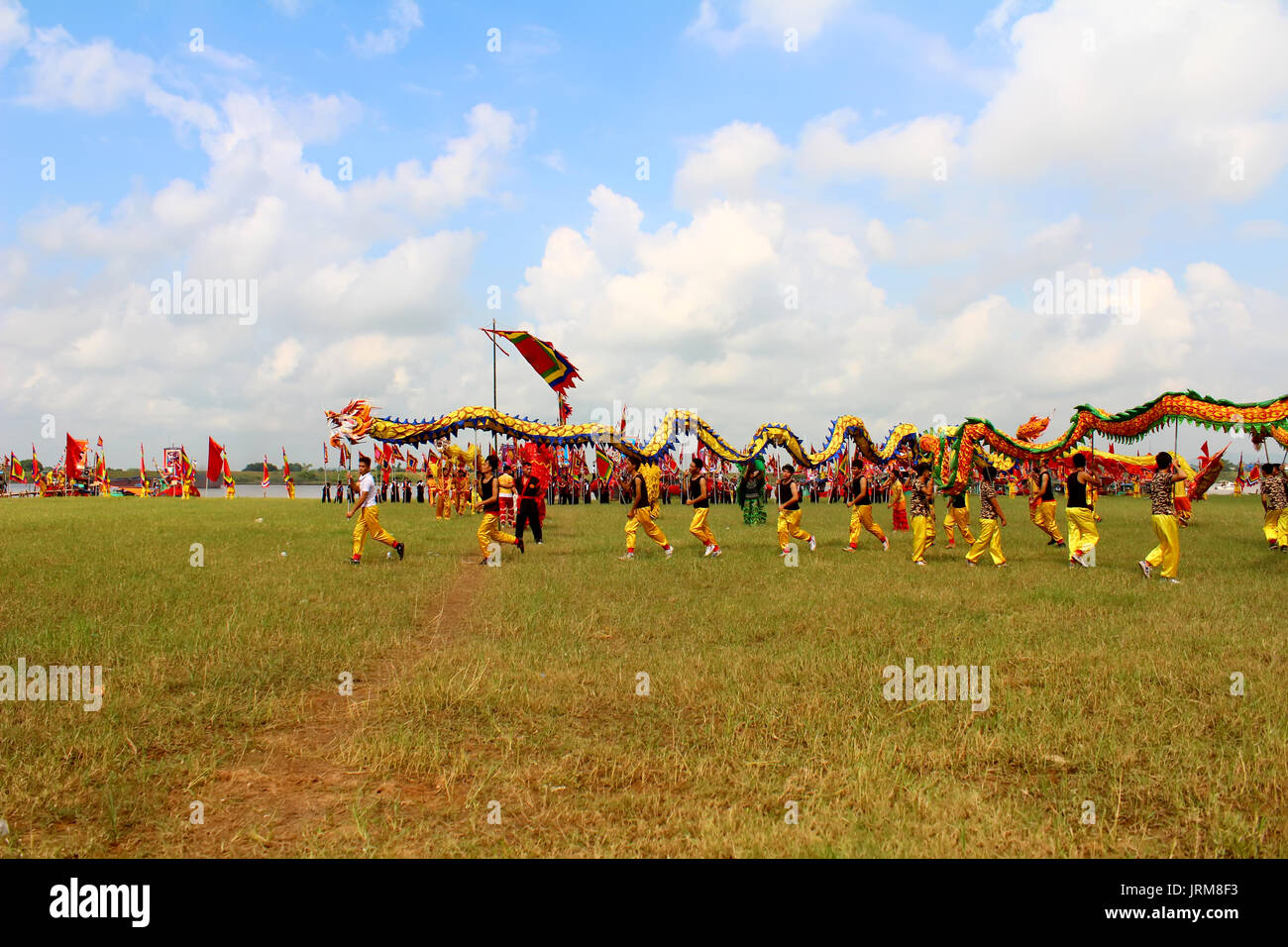 HAI DUONG, VIETNAM, SEPTEMBER, 10: a group of Asian people dance dragon in folk festivals on September, 10, 2014 in Hai Duong, Vietnam Stock Photo