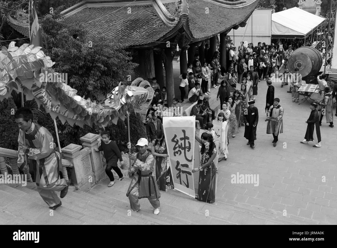 HAI DUONG, VIETNAM, February 14: a group of Asian people dance dragon in folk festivals on February 14, 2014 in Con Son pagoda, Hai Duong, Vietnam. Stock Photo