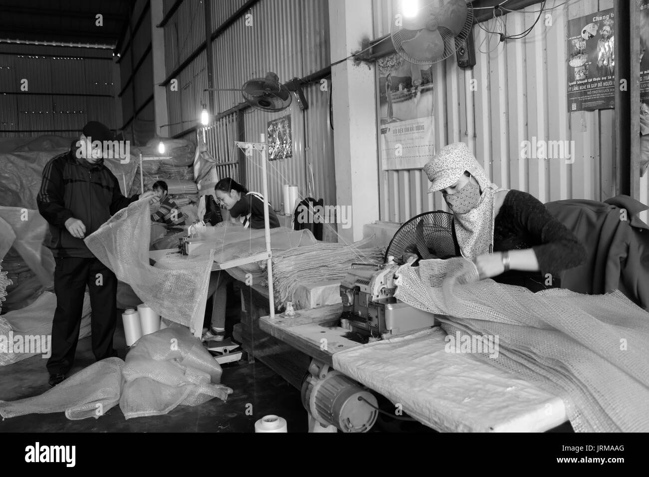 HAI DUONG, VIETNAM, January,5: workers in the sewing factory on January,5, 2014 in Hai Duong, Vietnam Stock Photo