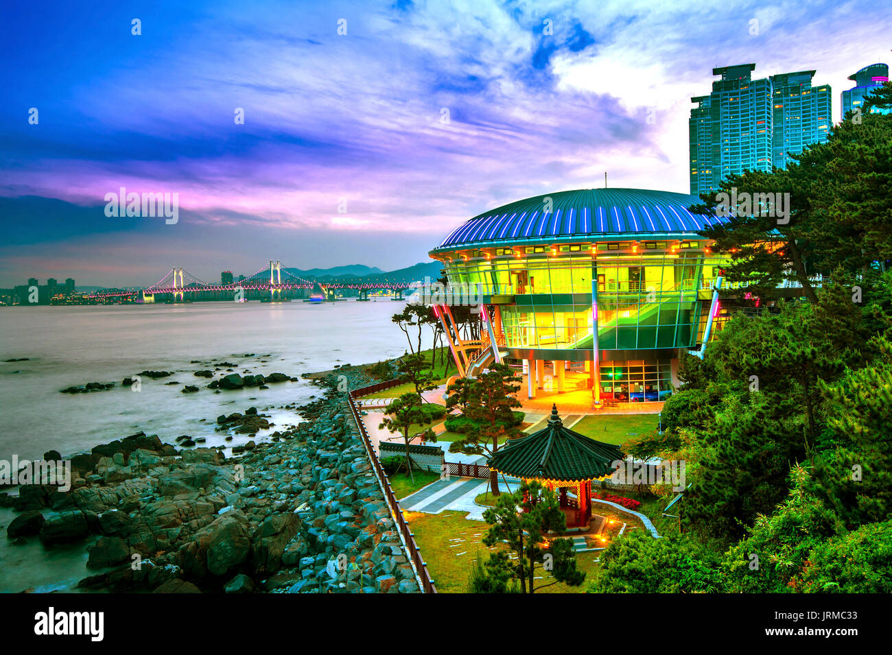 Dongbaek island with Nurimaru APEC House and Gwangan bridge at sunset in Busan,South Korea Stock Photo