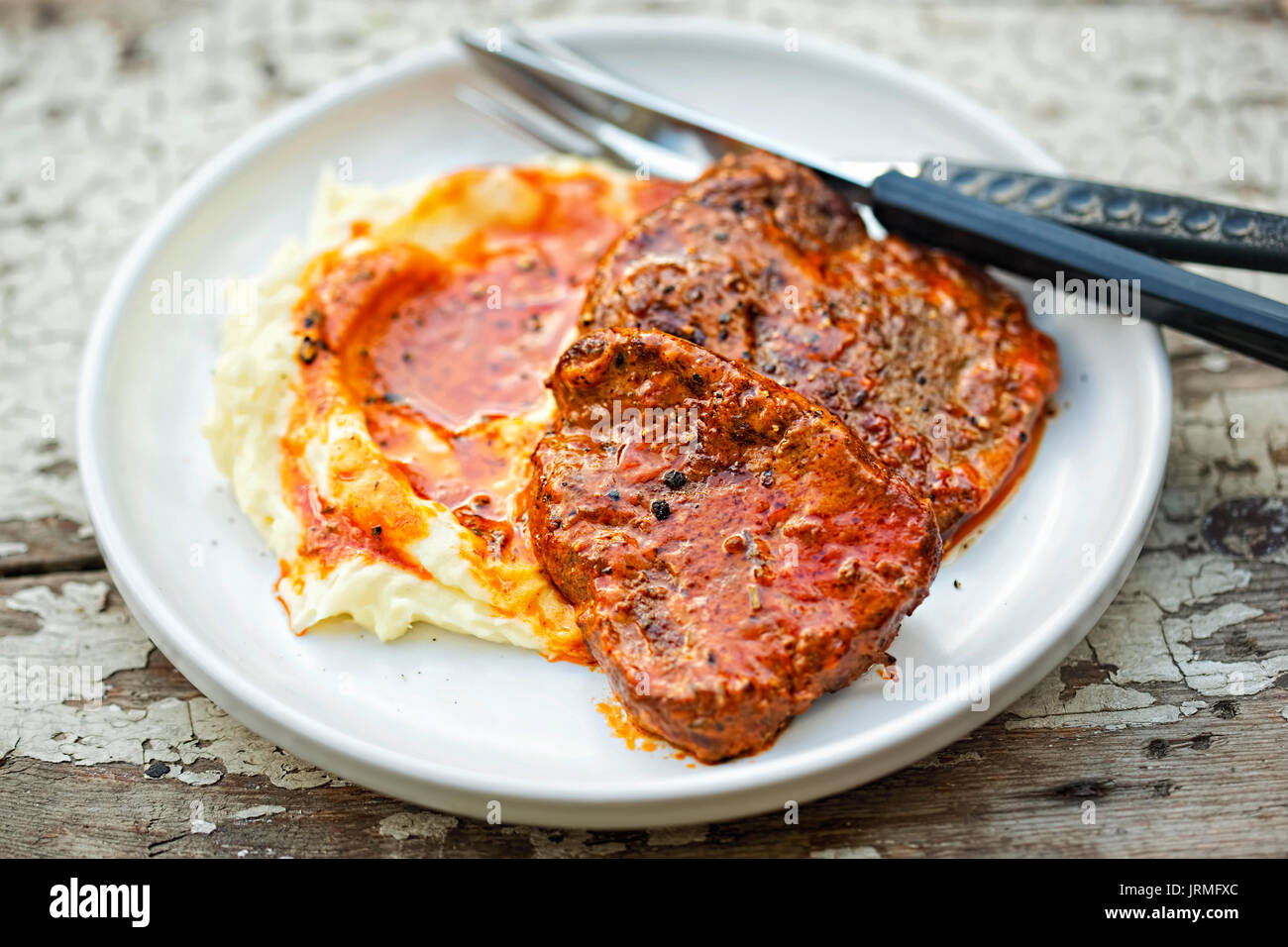 Beef steak in tomato sauce with tomato puree Stock Photo Alamy