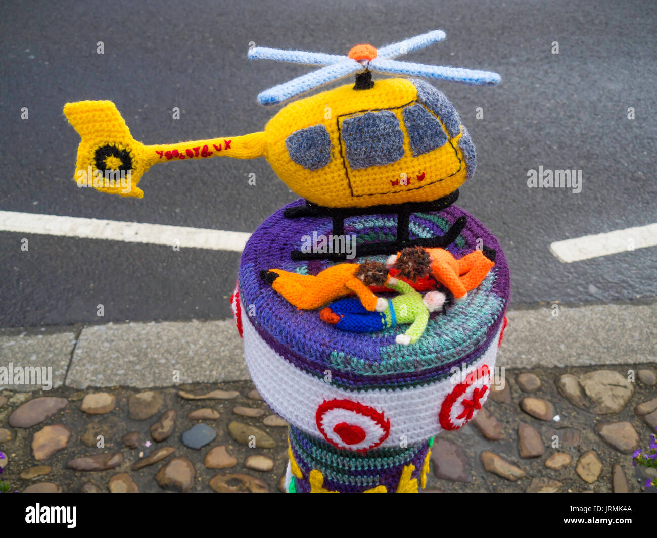 Yarn Bombing decorating public place with knitted objects here in