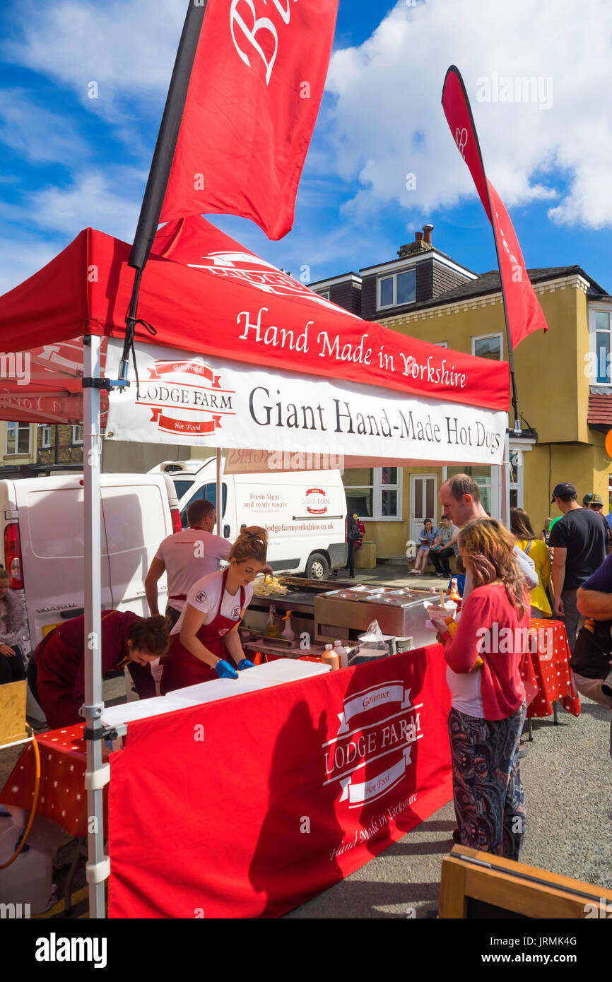 At the Annual Saltburn Food Festival 2017 a bright red stall selling Giant Hand-made Hot Dogs, Made in Yorkshire Stock Photo