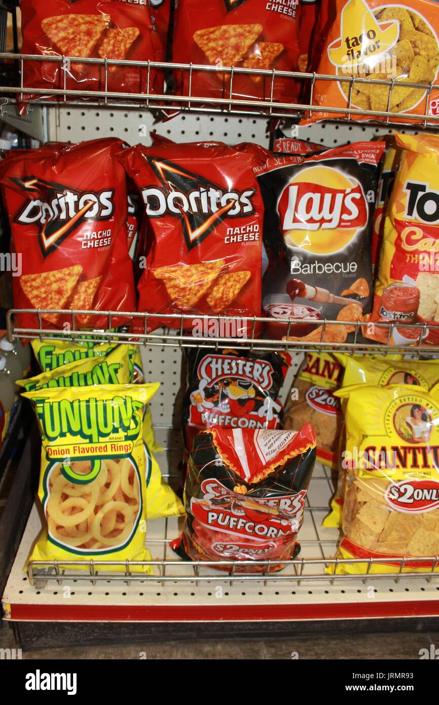 Bags of different Chips on a shelf at a Convenient Store in Sterling Kansas. Stock Photo