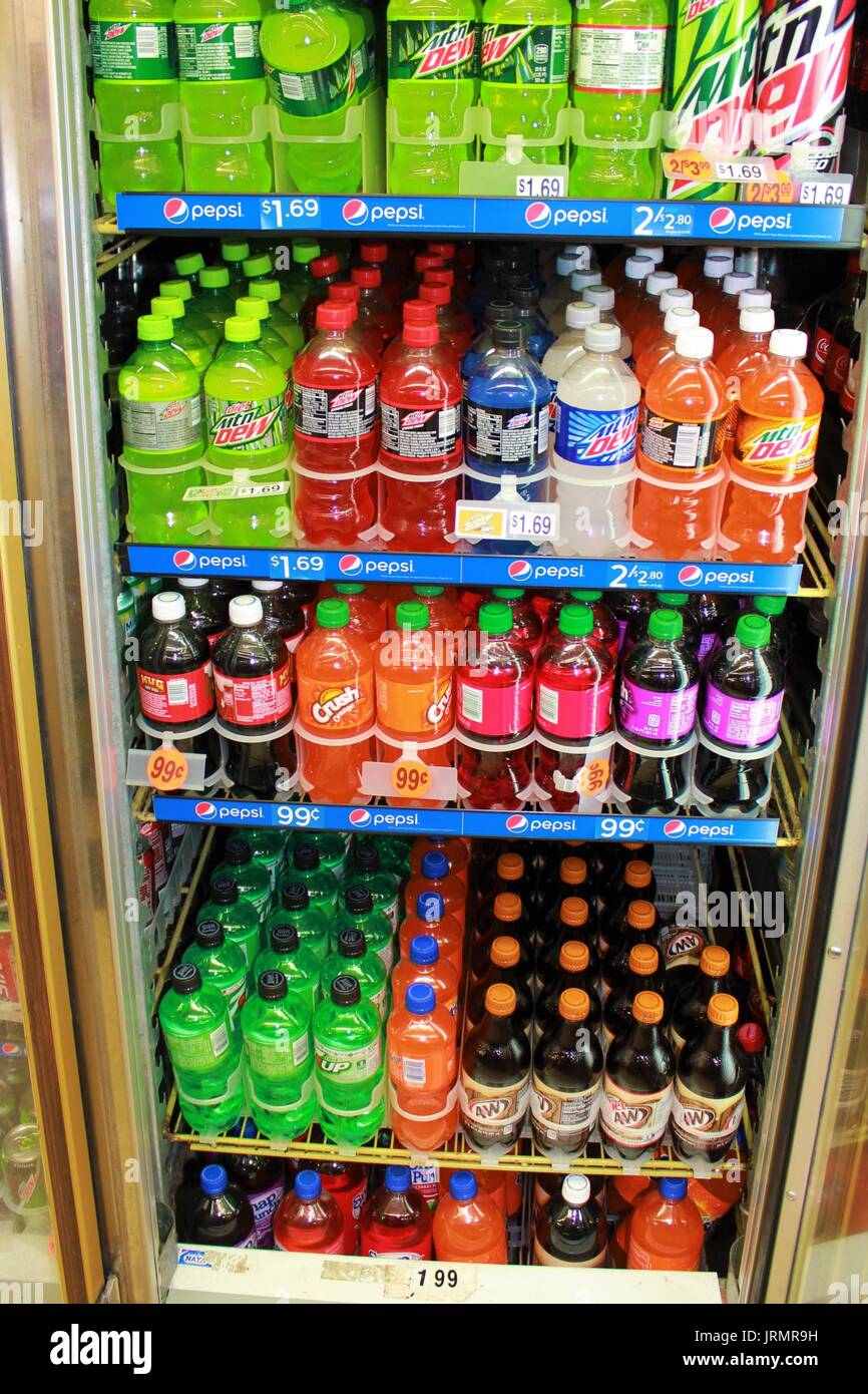 Cold Drinks in a cooler with the door open Stock Photo
