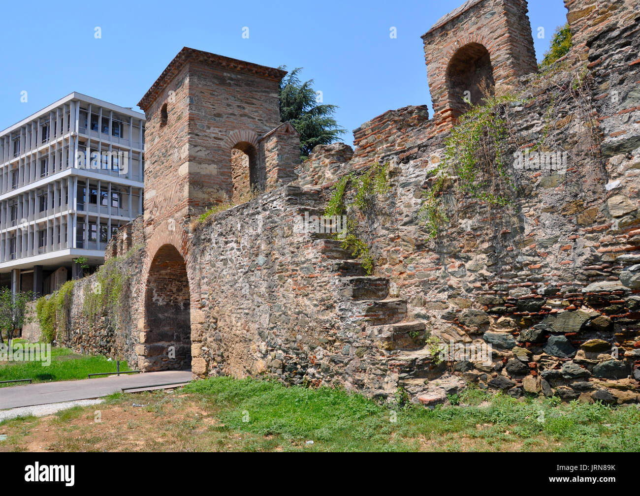 'the old and the new' in town Thessaloniki Greece, A tower of the western wall of Thessaloniki,Vardar Tophane,Tabak-Hane, Fortress Vardar, Top Hane, K Stock Photo