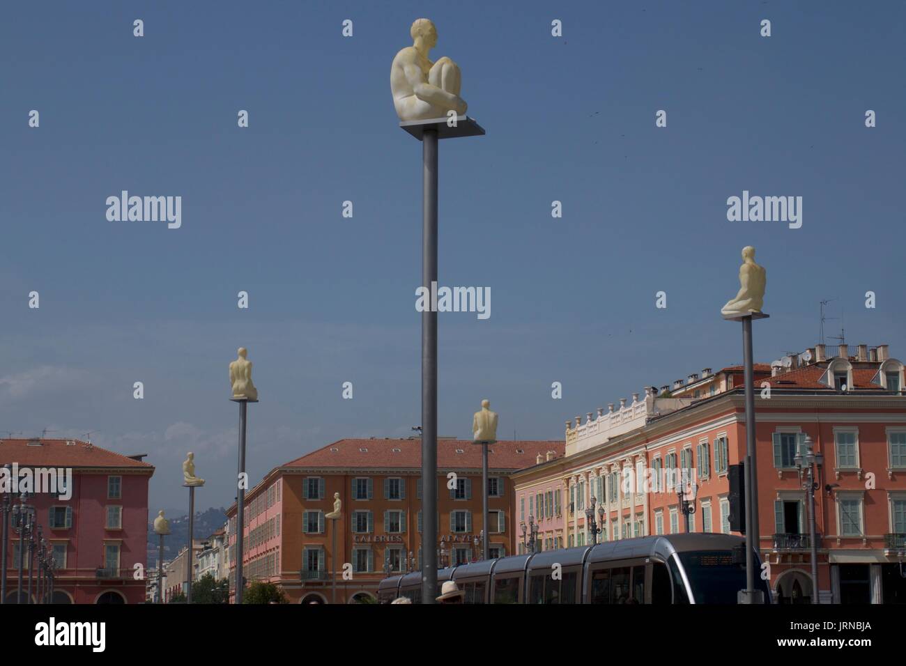 White sculptures sitting on tall plinths above Massena Square, Nice, France Stock Photo