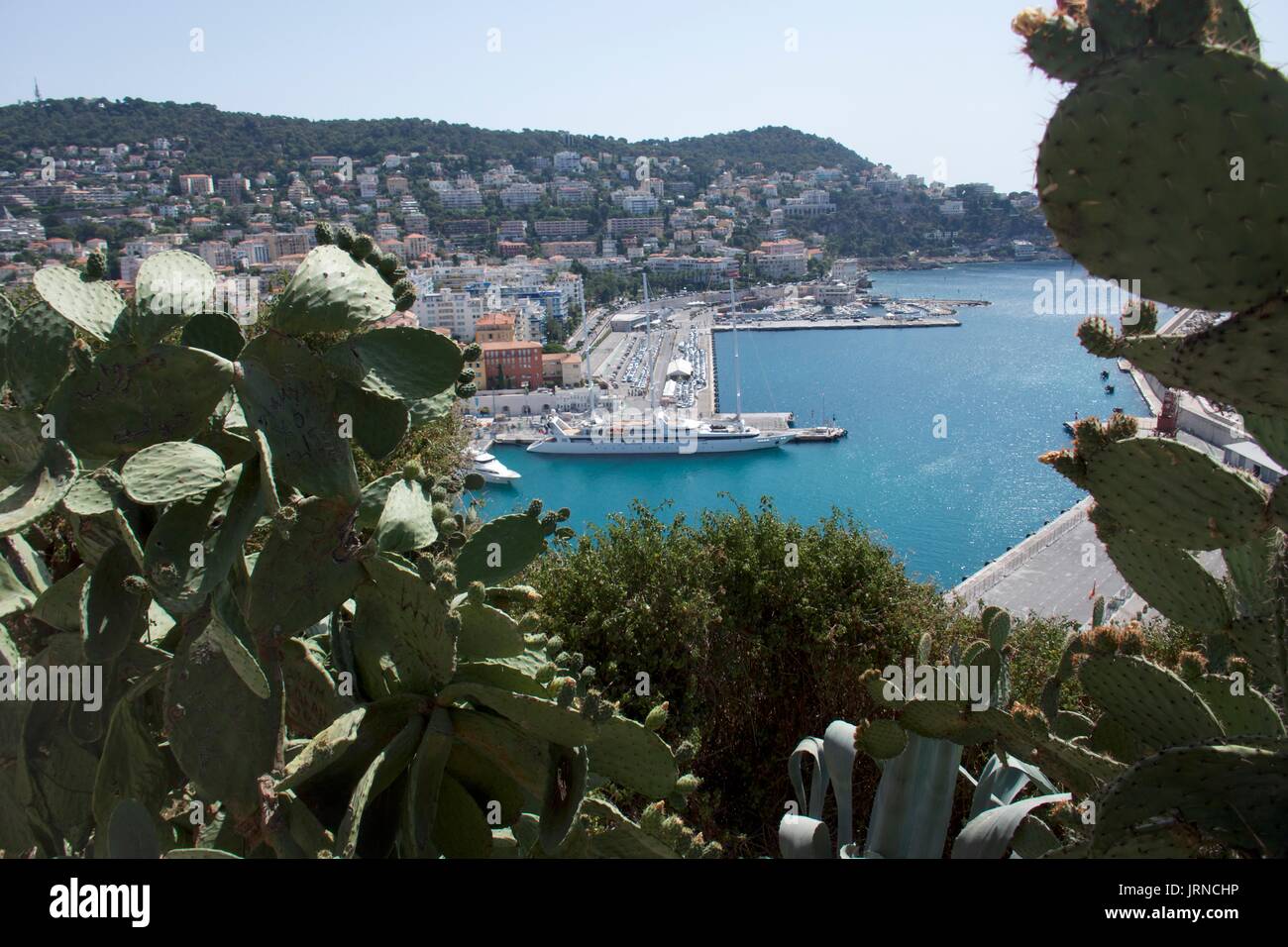 Distant view of waterfront marina and super yacht, Nice, France Stock Photo