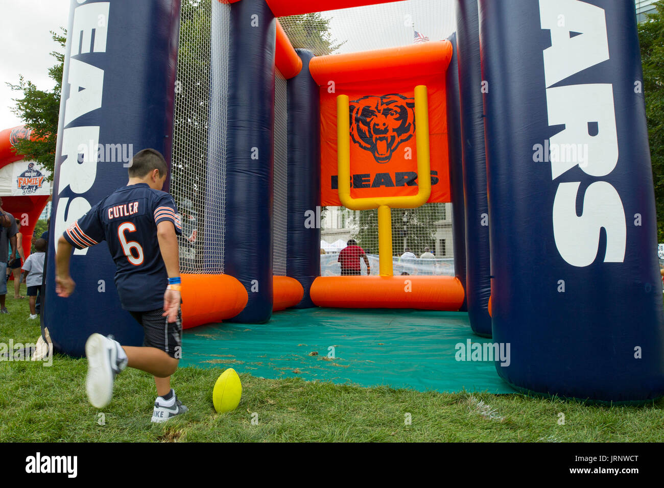 Chicago, Illinois, USA. 5th August, 2017. A young Chicago Bears fan takes part in the Family Fest games outside of the field during training camp at Soldier Field in Chicago, IL. Credit: Cal Sport Media/Alamy Live News Stock Photo