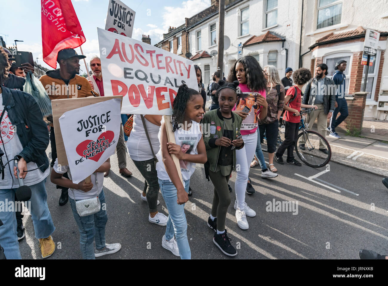 London, UK. 4th Aug, 2017. London, UK. 4th August 2017. People incuding many families and firends of people killed by police march from Broadwater Farm to a rally at Tottenham Police Station remembering the death of Mark Duggan on the sixth anniversary of his killing. The event also remembered the police killing of other members of the Tottenham community - Cynthia Jarrett, Joy Gardner, Roger Sylvester, Mark Duggan and Jermaine Baker and the recent murders of Rashan Charles, Darren Cumberbatch and Edson Da Costa. Led by Stafford Scott, there was poetry, a minute of silence and speeches from Stock Photo