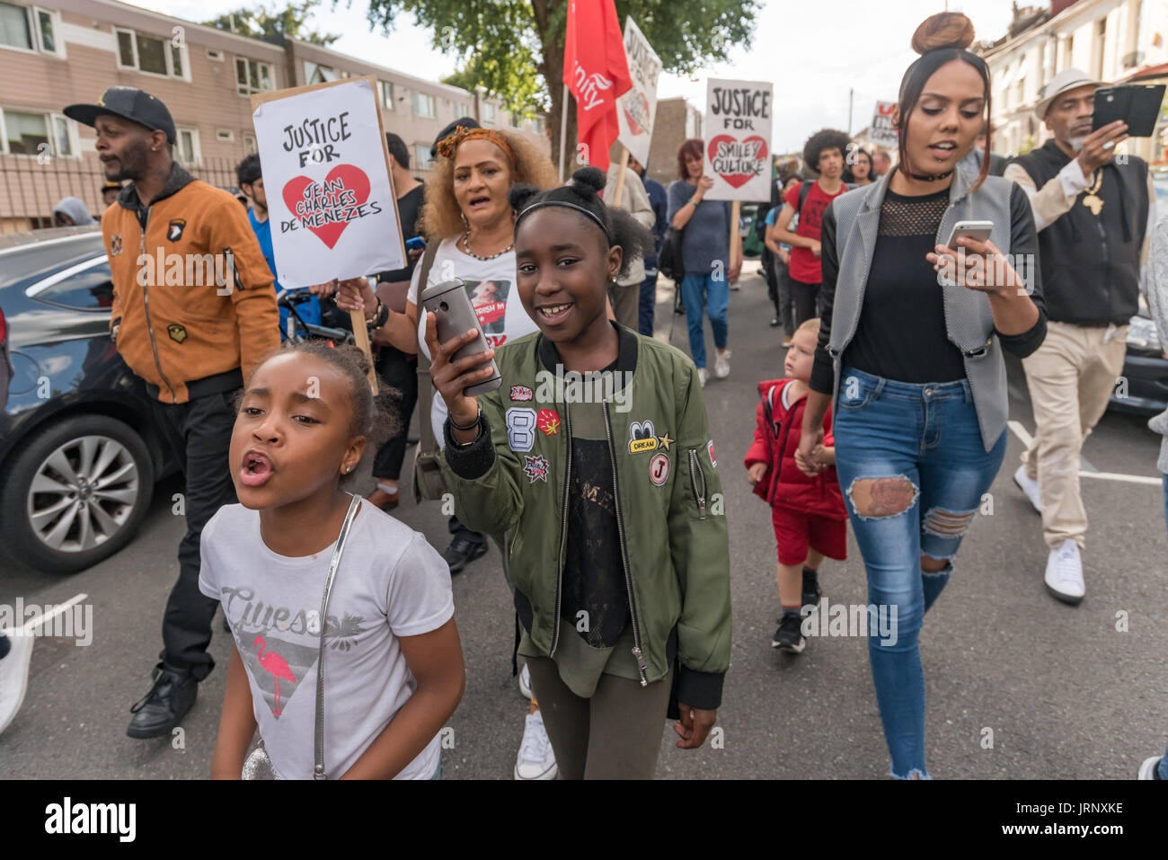 London, UK. 4th Aug, 2017. London, UK. 4th August 2017. People incuding many families and firends of people killed by police march from Broadwater Farm to a rally at Tottenham Police Station remembering the death of Mark Duggan on the sixth anniversary of his killing. The event also remembered the police killing of other members of the Tottenham community - Cynthia Jarrett, Joy Gardner, Roger Sylvester, Mark Duggan and Jermaine Baker and the recent murders of Rashan Charles, Darren Cumberbatch and Edson Da Costa. Led by Stafford Scott, there was poetry, a minute of silence and speeches from Stock Photo