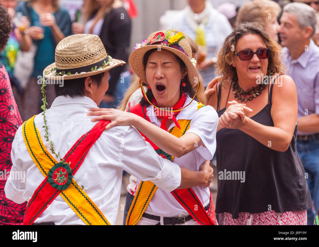 Sidmouth, UK. 6th August, 2017. Ow! You stood on my toe! Folk dancing in the Anchor Inn garden, Sidmouth, at the town's annual folk week. Sidmouth Folk Week Festival continues until the 11th August. Credit: Photo Central/Alamy Live News Stock Photo