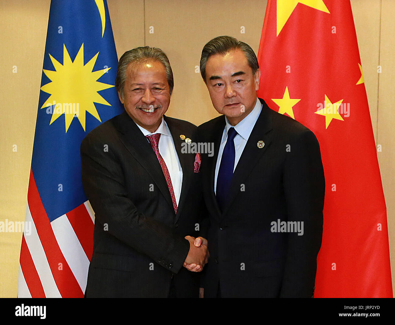 (170806) -- MANILA, Aug. 6, 2017 (Xinhua) -- Chinese Foreign Minister Wang Yi (R) meets with his Malaysian counterpart Anifah Aman on the sidelines of a series of ASEAN foreign ministers' meetings in Manila, the Philippines, Aug. 6, 2017. (Xinhua/Rouelle Umali) (djj) Stock Photo