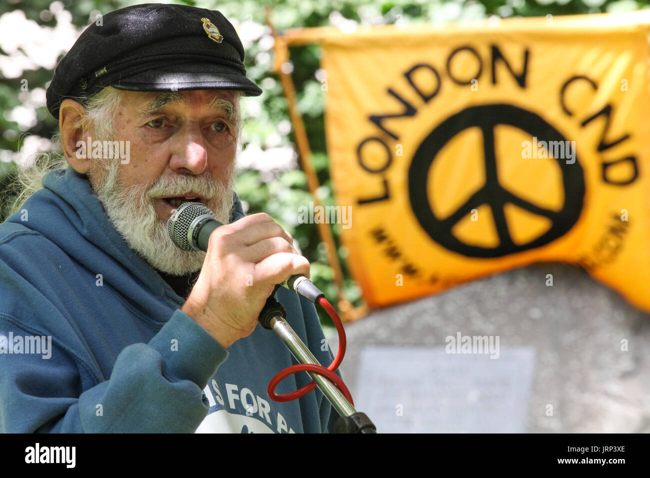 London, UK. 6th August, 2017. Jim Radford, D-Day veteran, folk singer and peace campaigner with Veterans for Peace, addresses peace campaigners attending the annual Hiroshima Day anniversary event in Tavistock Square, next to the commemorative Hiroshima cherry tree. Credit: Mark Kerrison/Alamy Live News Stock Photo